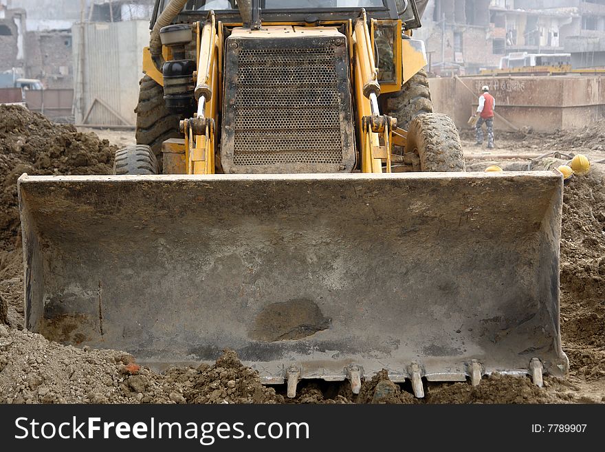 Heavy, earth-moving machinery at a construction site.