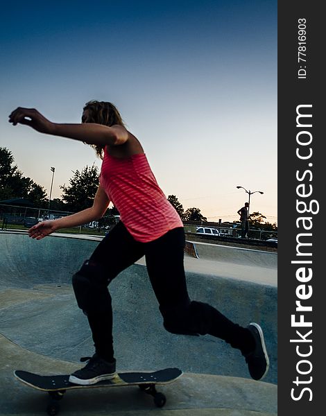 Young female skateboarder at the skatepark