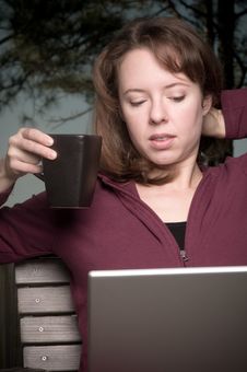 Young Woman With Coffee And Laptop Stock Images Young Woman With Coffee And Laptop Stock Images