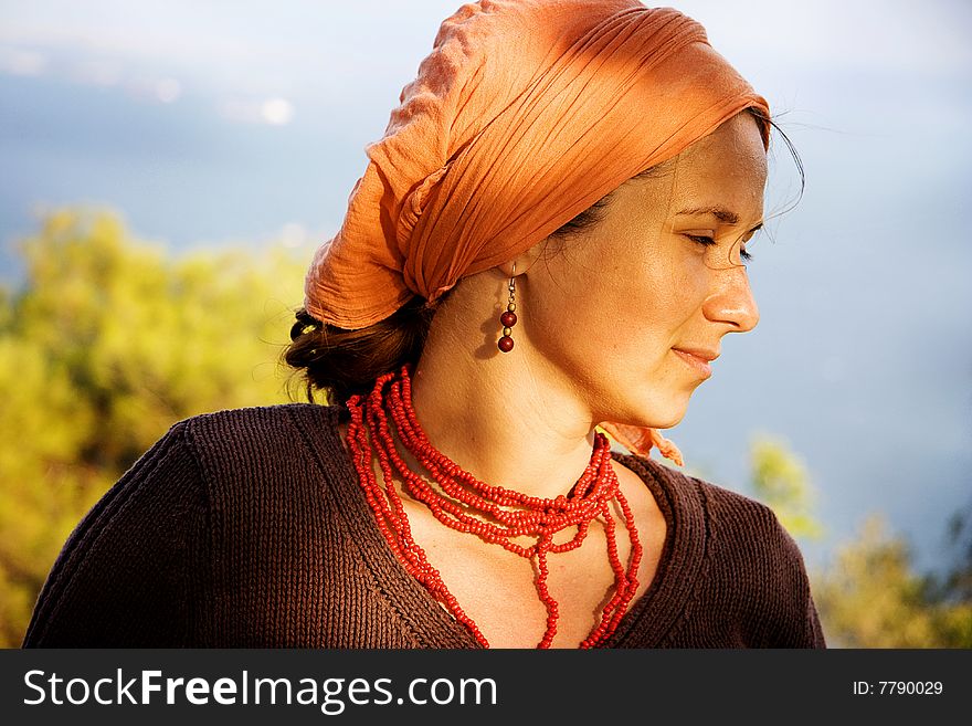 Beauty portrait of a young woman with scarf