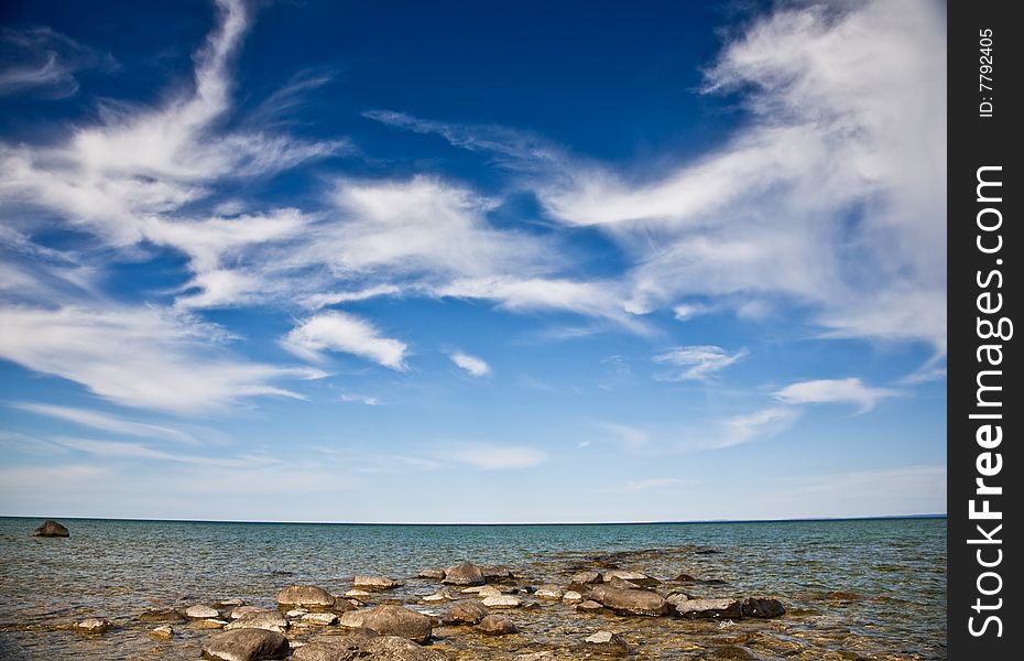 Open blue sky over rocky beach. Open blue sky over rocky beach