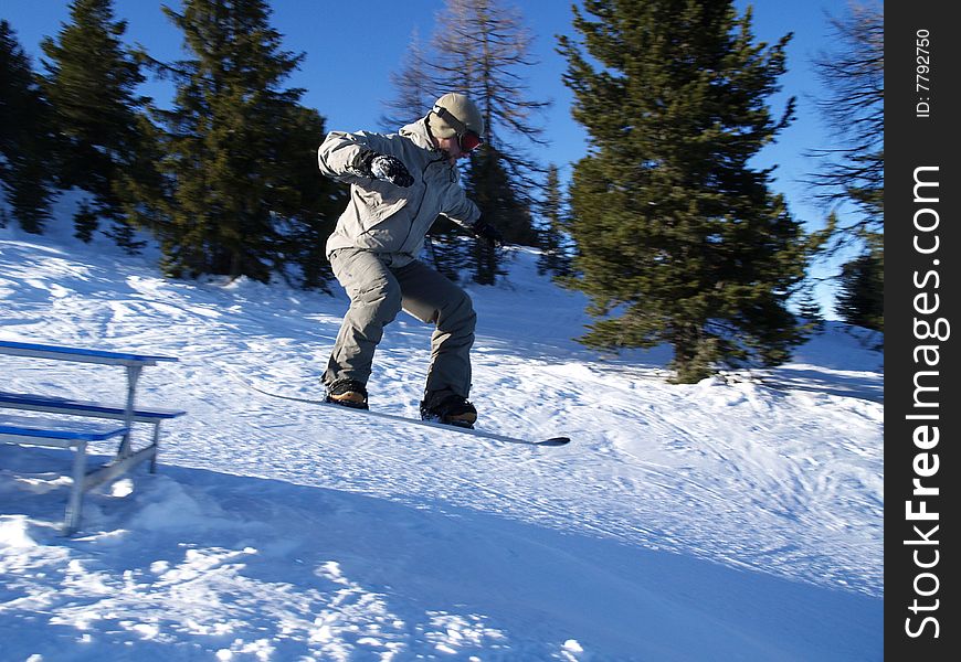 Snowboarder jumps off the table