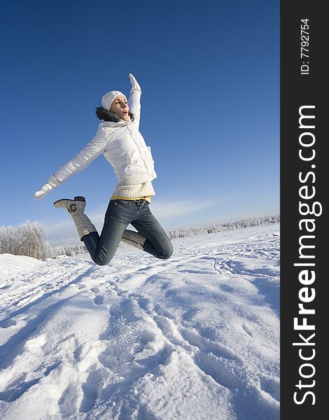 Happy jumping girl relaxing outdoors