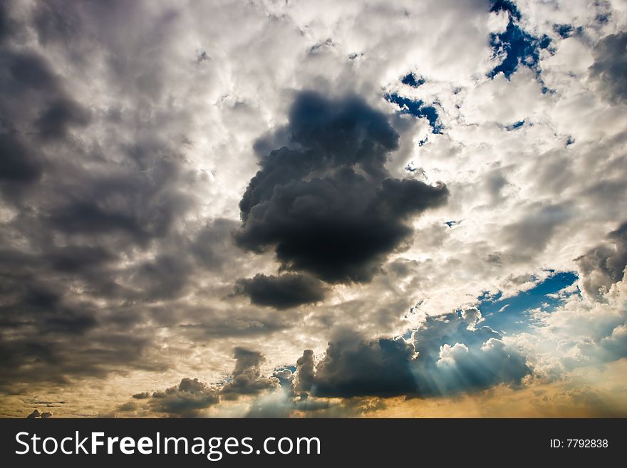 Cloudscape with sun ray shining through.