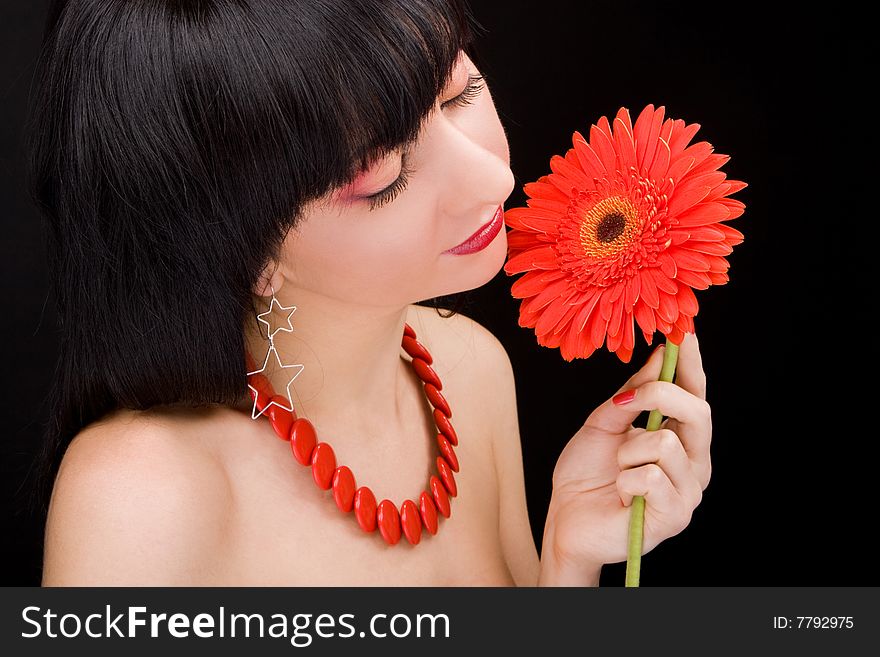 Young woman with red flower