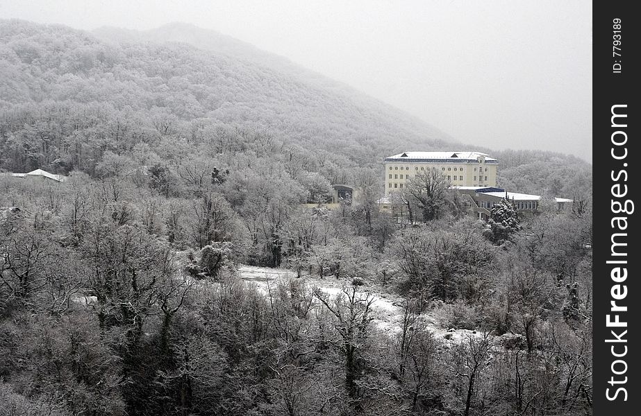 Castle in mountains in the forest in winter time. Castle in mountains in the forest in winter time