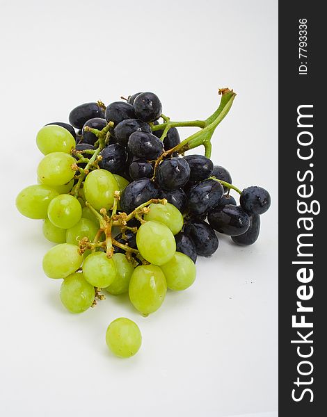 A large bunch of fresh red and white grapes. A large bunch of fresh red and white grapes