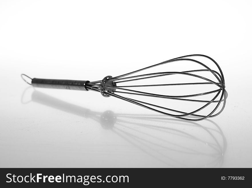 Wire whisk isolated on white