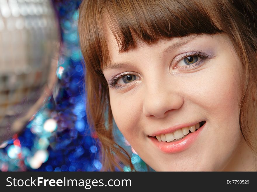 Beautiful lady in night club standing near the small disco ball. Beautiful lady in night club standing near the small disco ball