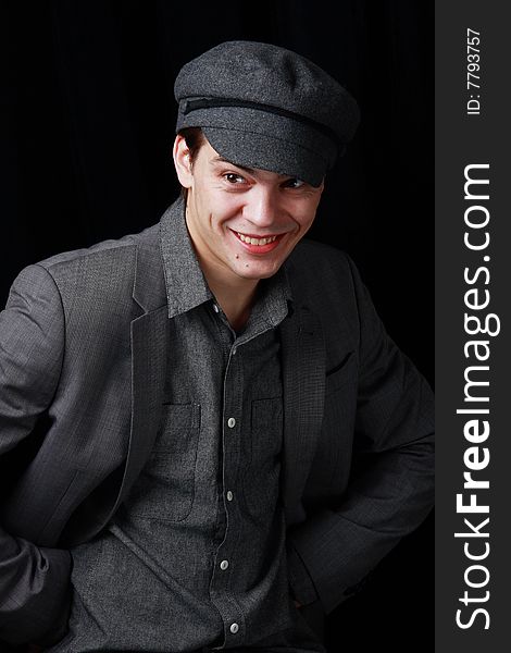 Portrait of a smiling young man on black background. Portrait of a smiling young man on black background