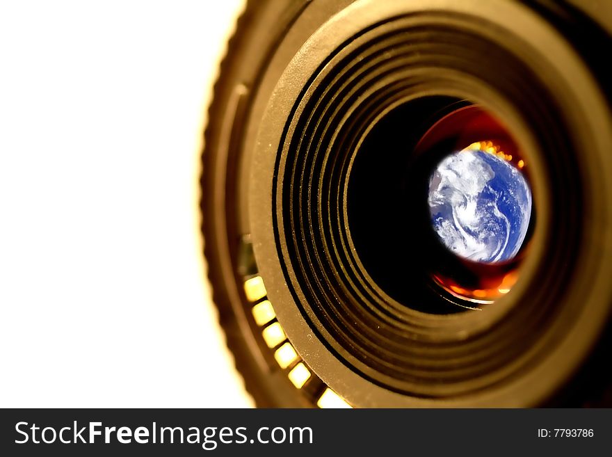 A camera lens and planet earth in the glass. A camera lens and planet earth in the glass