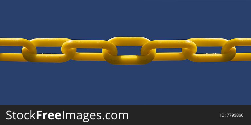 Close up of unbroken chain link set against blue sky background for copy text