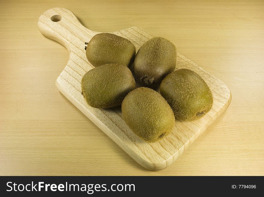 Kiwi fruits on cutting board