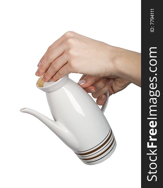 Female hand keeps teapot on white background