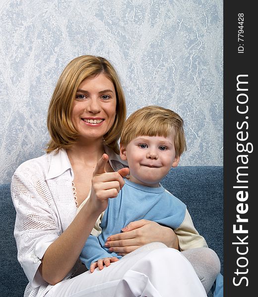 Portrait of young mum with the beautiful small son. Portrait of young mum with the beautiful small son