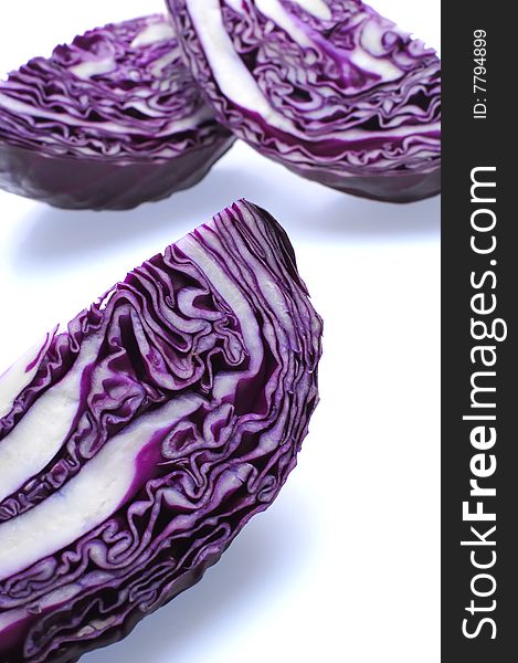 Red cabbage slices on white