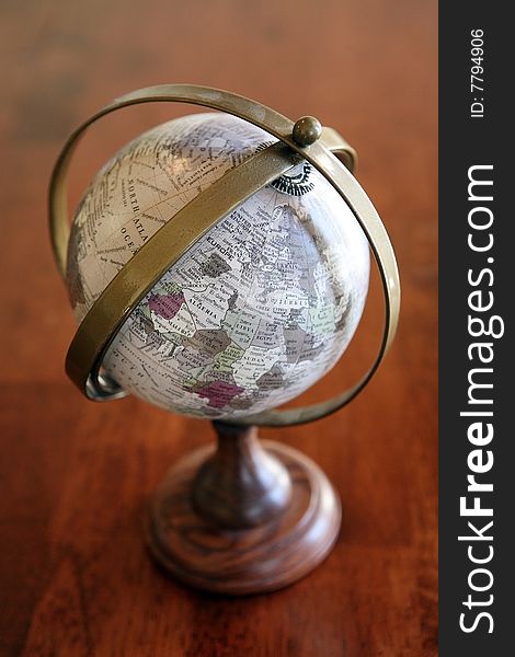 Diminutive Globe on the table.