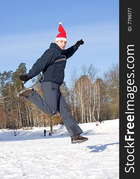 Man jumping on a background the forest in winter. Man jumping on a background the forest in winter