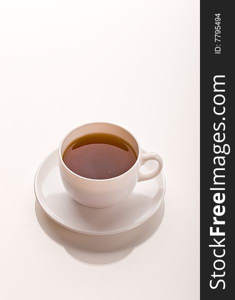 Still life, cup of tea over light background