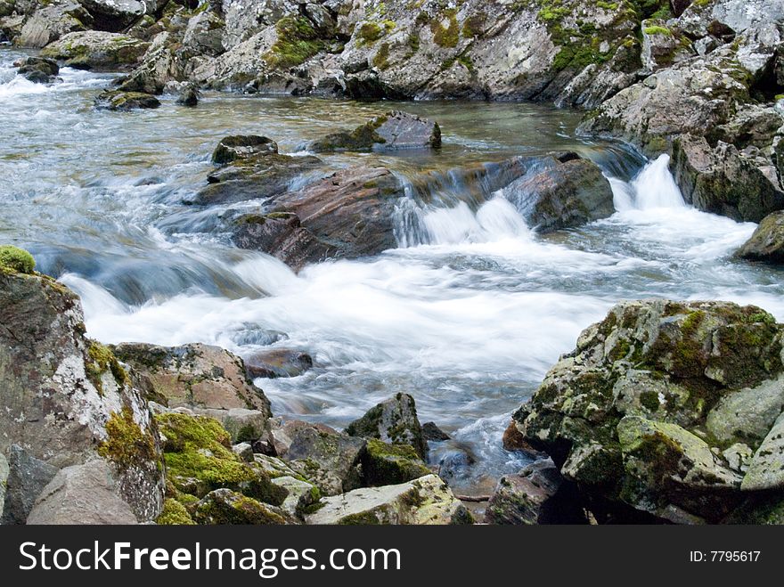 Mountain stream with cataracts in Norway