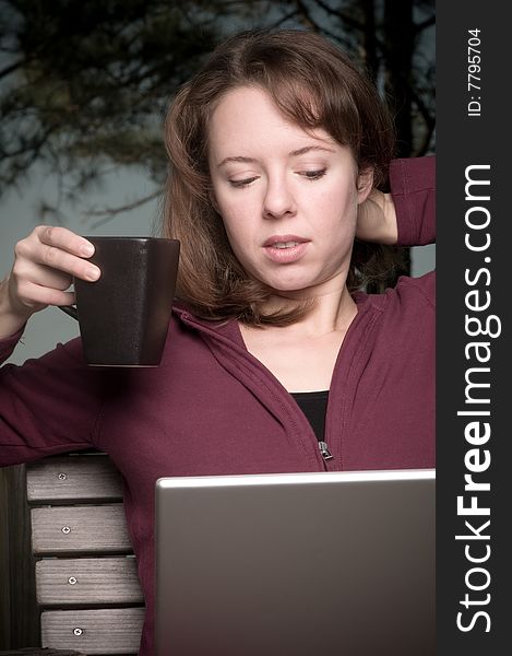 Young Woman With Coffee And Laptop