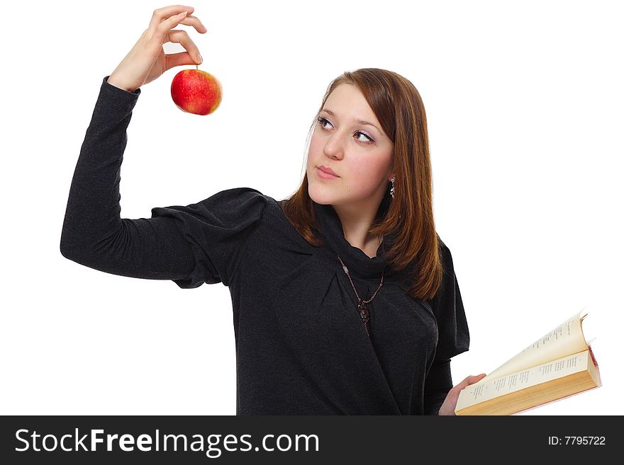 The girl with the book and a red apple on a white background. The girl with the book and a red apple on a white background