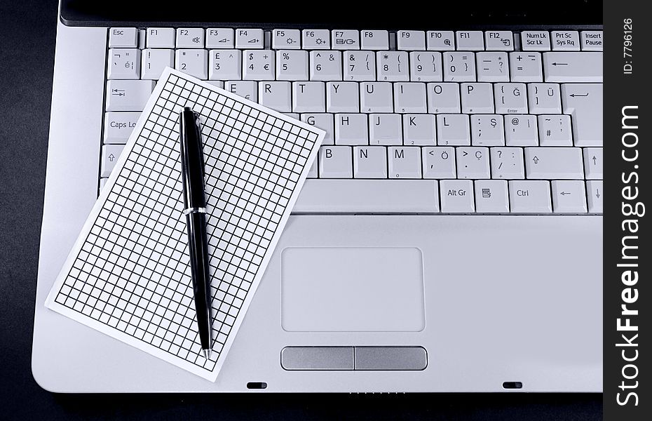 Laptop notepaper and pencil on white background. Laptop notepaper and pencil on white background