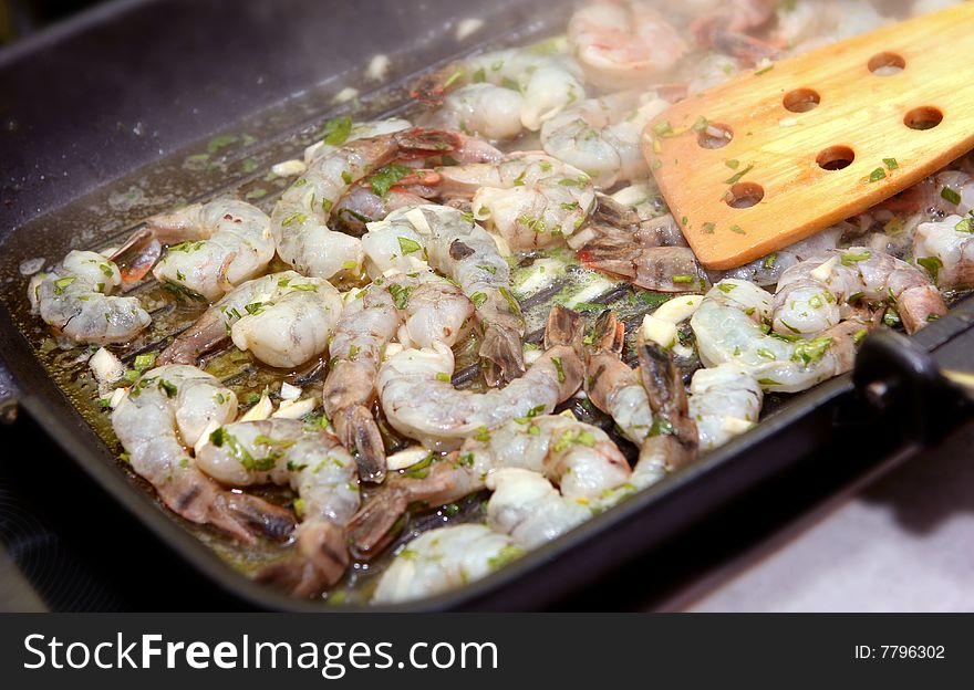The photograph of fried seafood on the frying pan (shrimps). The photograph of fried seafood on the frying pan (shrimps)
