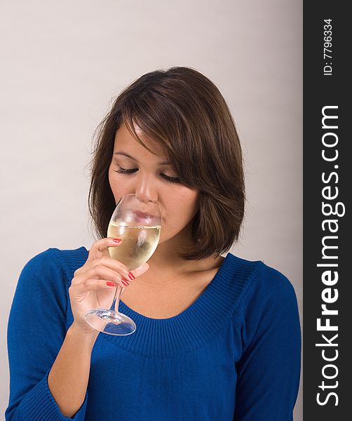 Girl drinking a glass of white wine