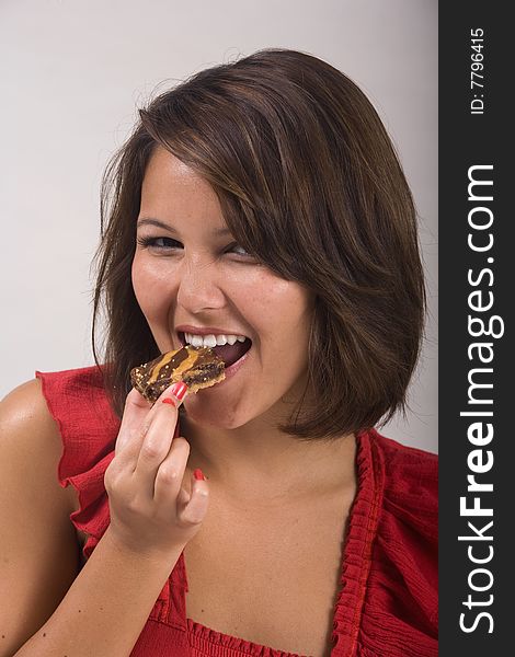 Girl Eating A Chocolate Dessert