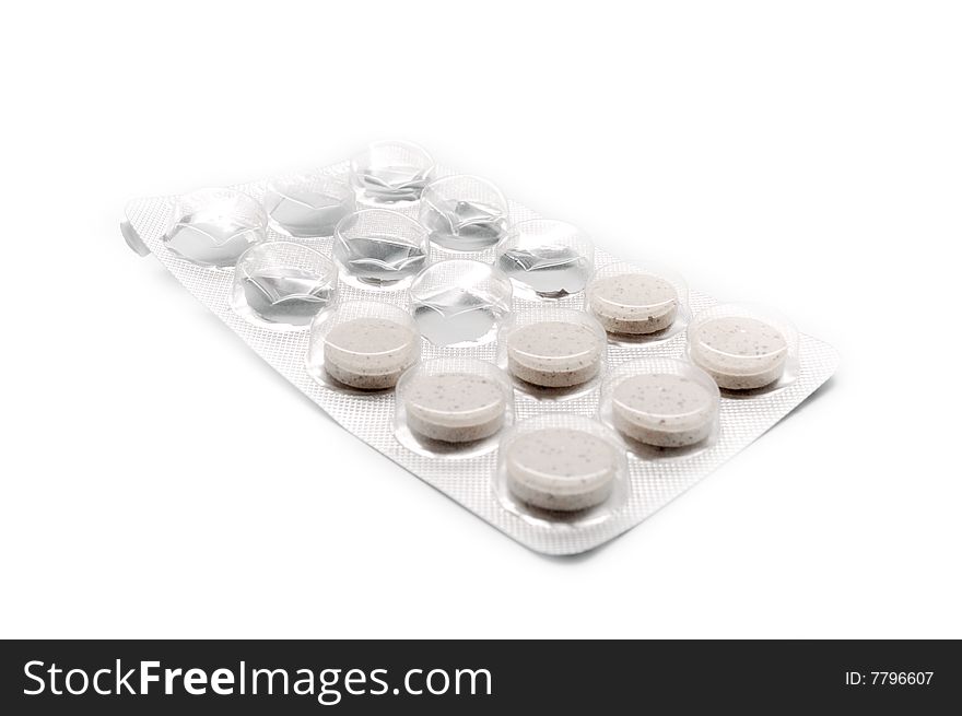 Near-empty blister pack of pills against white (shallow DOF). Near-empty blister pack of pills against white (shallow DOF)