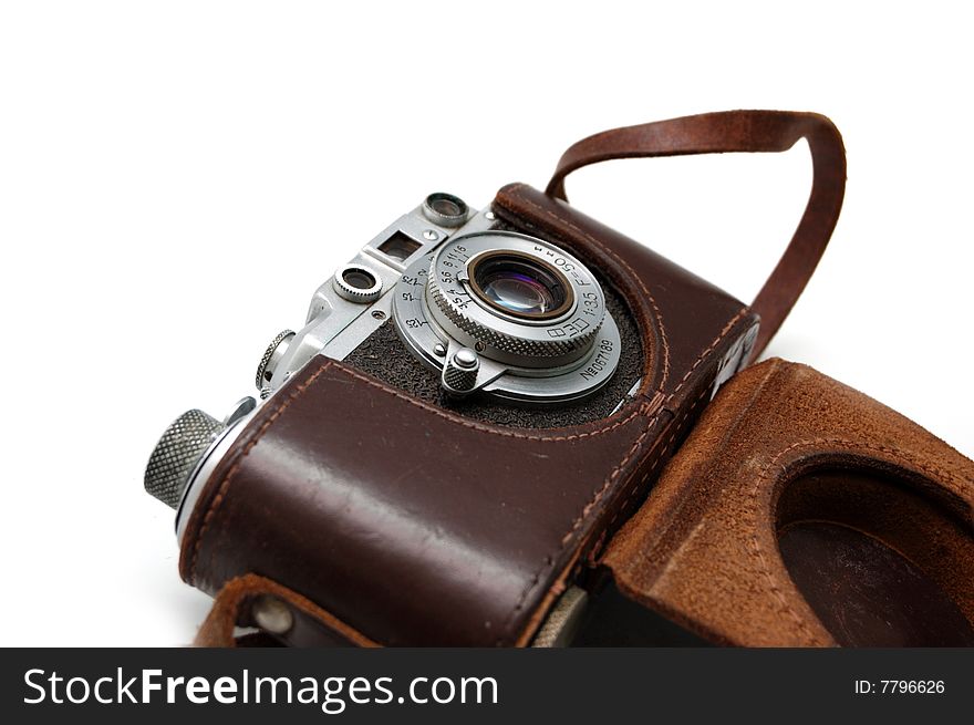 Old rangefinder vintage camera in a leather case against white