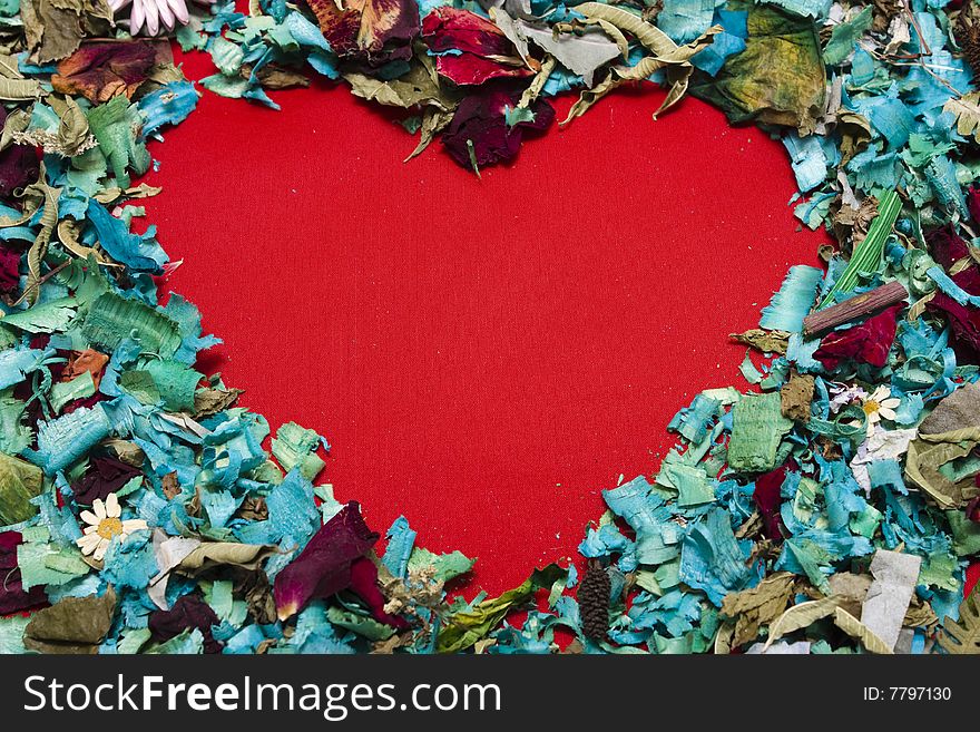 Heart shape on a background of petals, with copy space. Heart shape on a background of petals, with copy space.