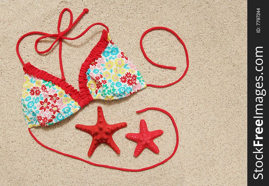Swimwear and starfish on the sand. Swimwear and starfish on the sand
