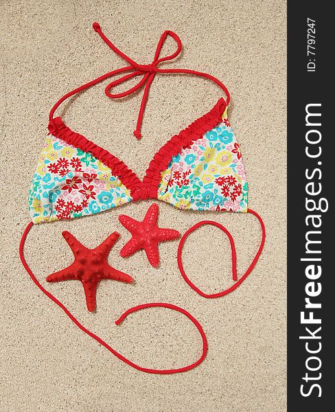 Swimwear and starfish on the sand. Swimwear and starfish on the sand