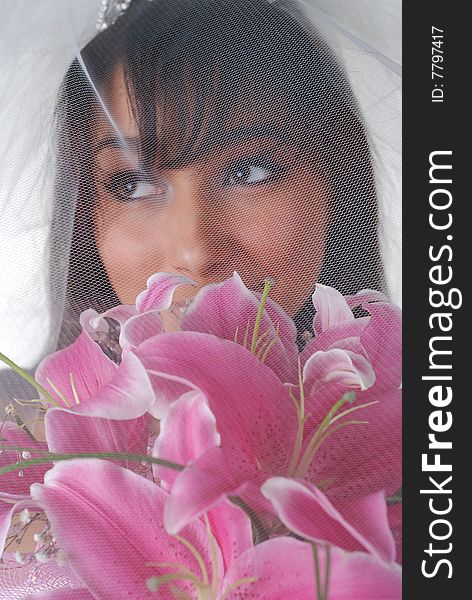 Portrait of young dark-hair bride with bouquet of lilys. Portrait of young dark-hair bride with bouquet of lilys
