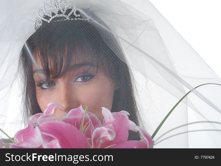 Portrait of young dark-hair bride with bouquet and tiara. Portrait of young dark-hair bride with bouquet and tiara