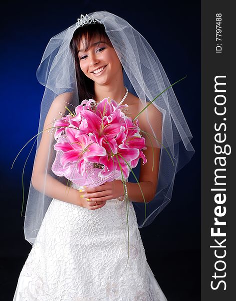 Portrait of young dark-hair bride with bouquet of lilys. Portrait of young dark-hair bride with bouquet of lilys