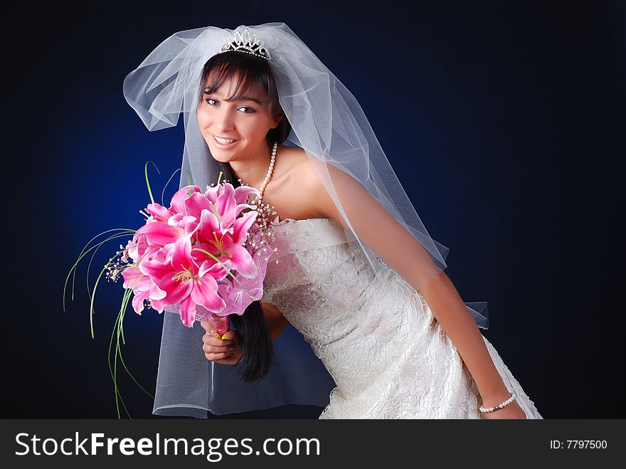 Portrait of young dark-hair bride with bouquet of lilys. Portrait of young dark-hair bride with bouquet of lilys