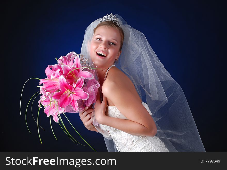 Young bride with bouquet of lilys on a black background