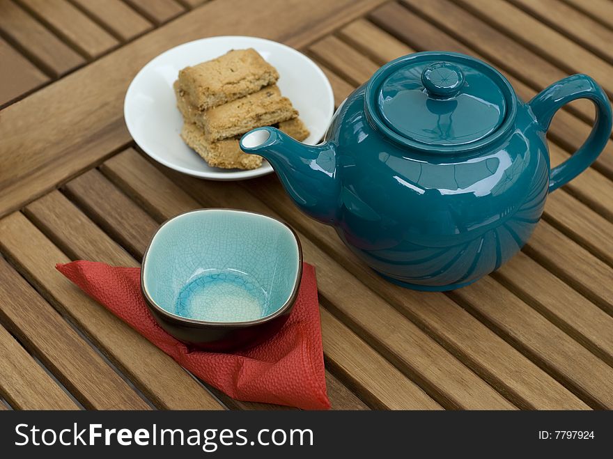 Tea pot with biscuits & cup on lunch break. Tea pot with biscuits & cup on lunch break