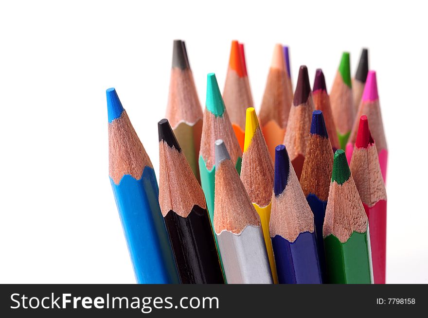 Thick colored pencils against a white background