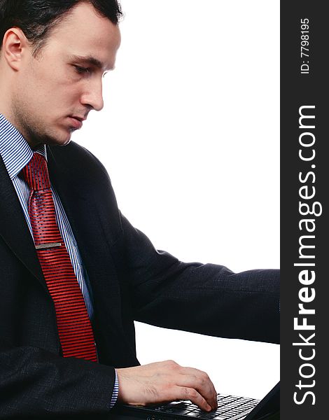 Businessman with the computer, isolated on a white background