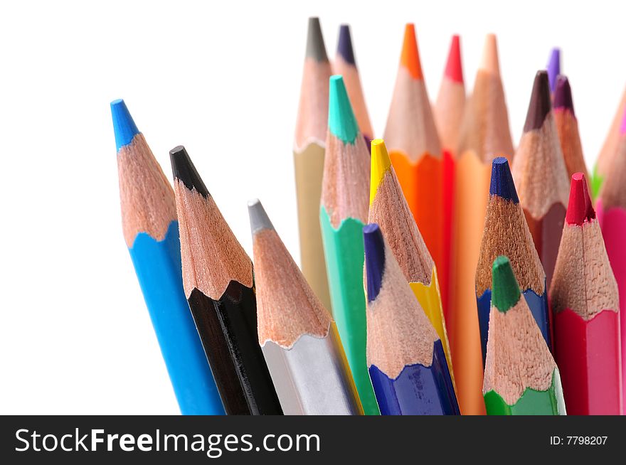 Thick colored pencils against a white background
