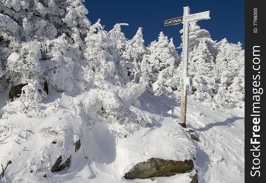 Frozen Cross at the top of a mountain