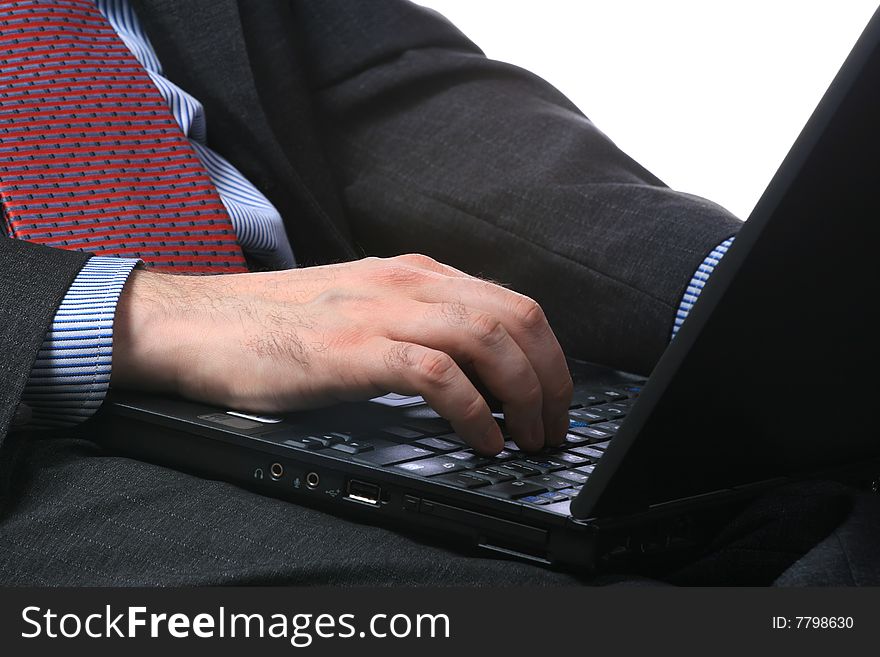 Businessman with the computer, isolated on a white background