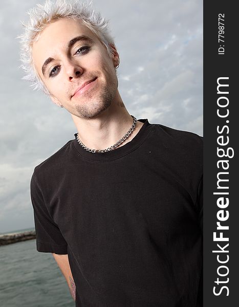 Young bleach blond haired teen smiling. Young bleach blond haired teen smiling