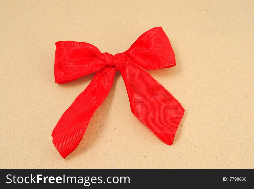 Red ribbon over a piece of paper