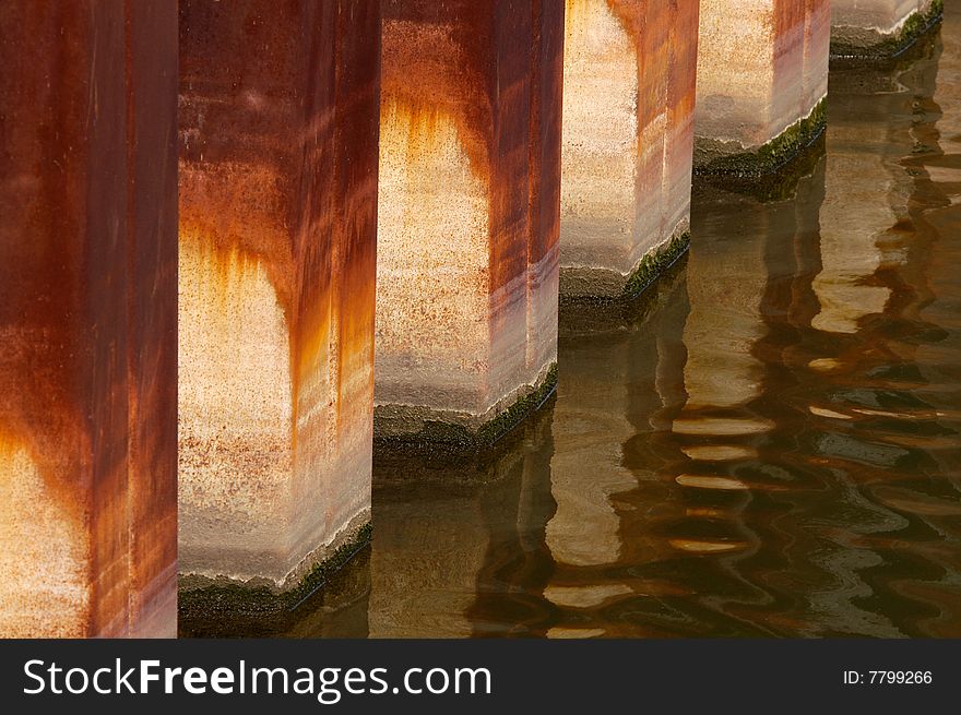 Base of a pier with oxidation from water