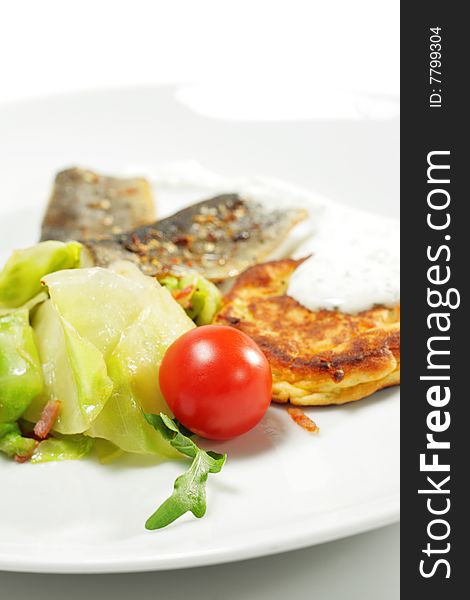 Cherry Tomato and Smoked Fish Fillet with Cabbage Salad and Thick Pancake. Isolated on White Background. Cherry Tomato and Smoked Fish Fillet with Cabbage Salad and Thick Pancake. Isolated on White Background